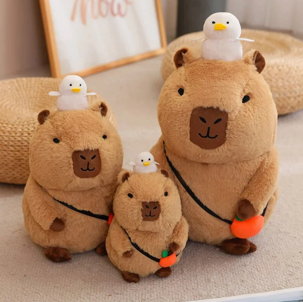 
                
                    Load image into Gallery viewer, Capybara Plushy with Orange
                
            