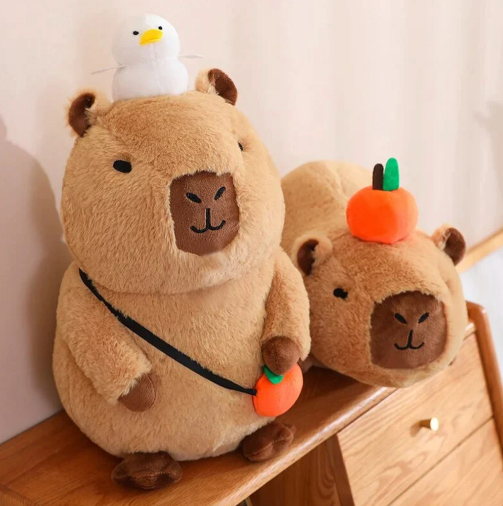 
                
                    Load image into Gallery viewer, Capybara Plushy with Orange
                
            